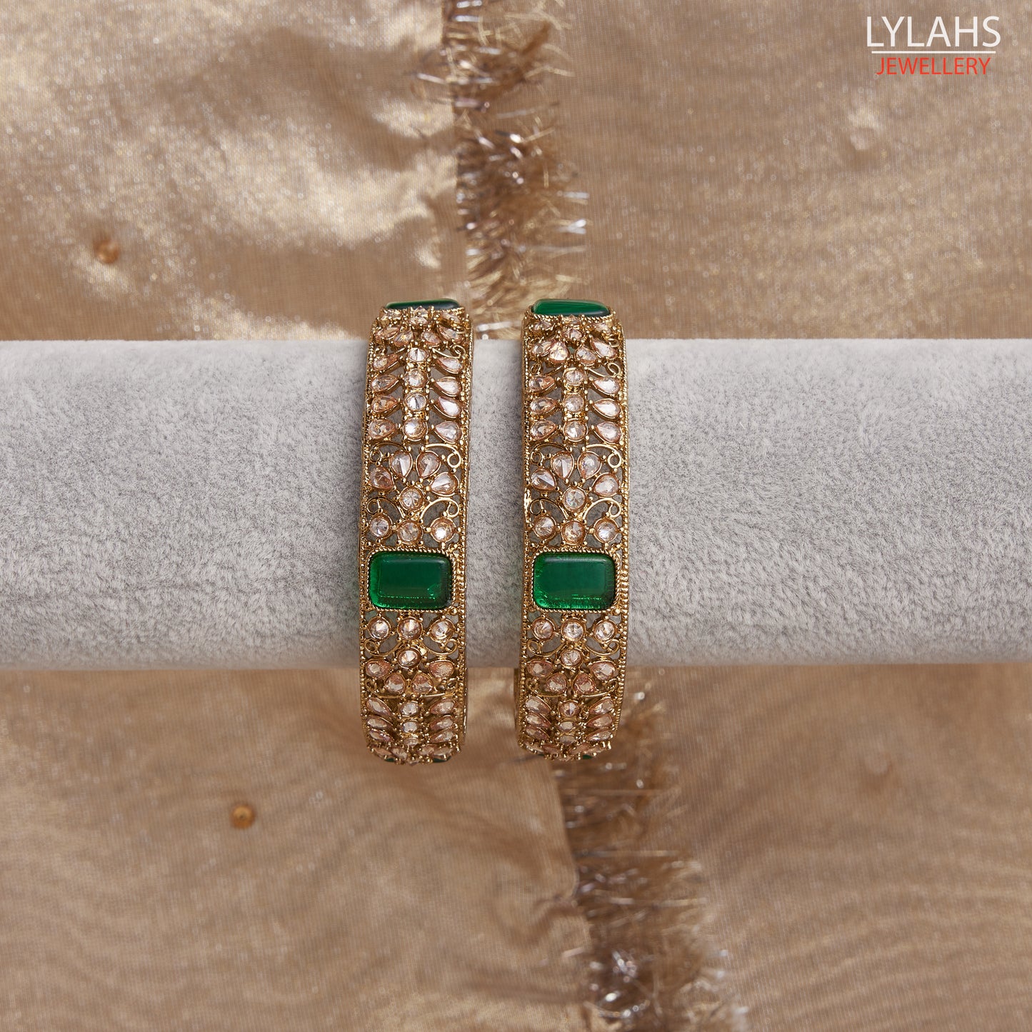 Gold pair of Karas with green stone from Lylahs Jewellery