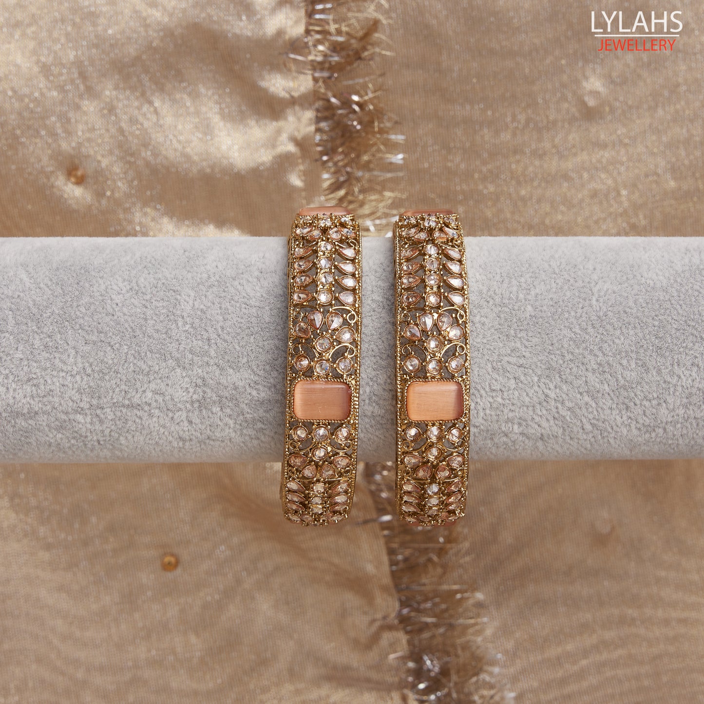 Gold pair of Karas with peach stone from Lylahs Jewellery