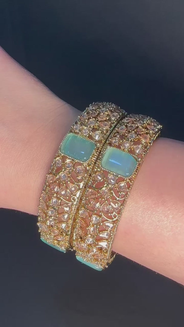 Gold pair of Karas with blue stone from Lylahs Jewellery - Close Up Video