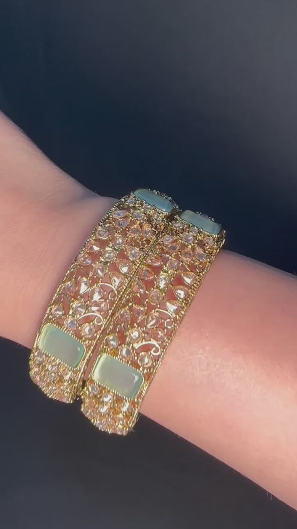 Gold pair of Karas with mint stone from Lylahs Jewellery - Close Up Video
