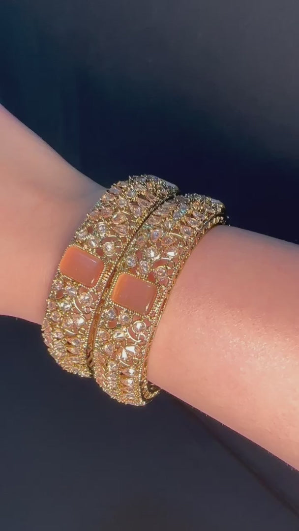 Gold pair of Karas with peach stone from Lylahs Jewellery - Close Up Video 