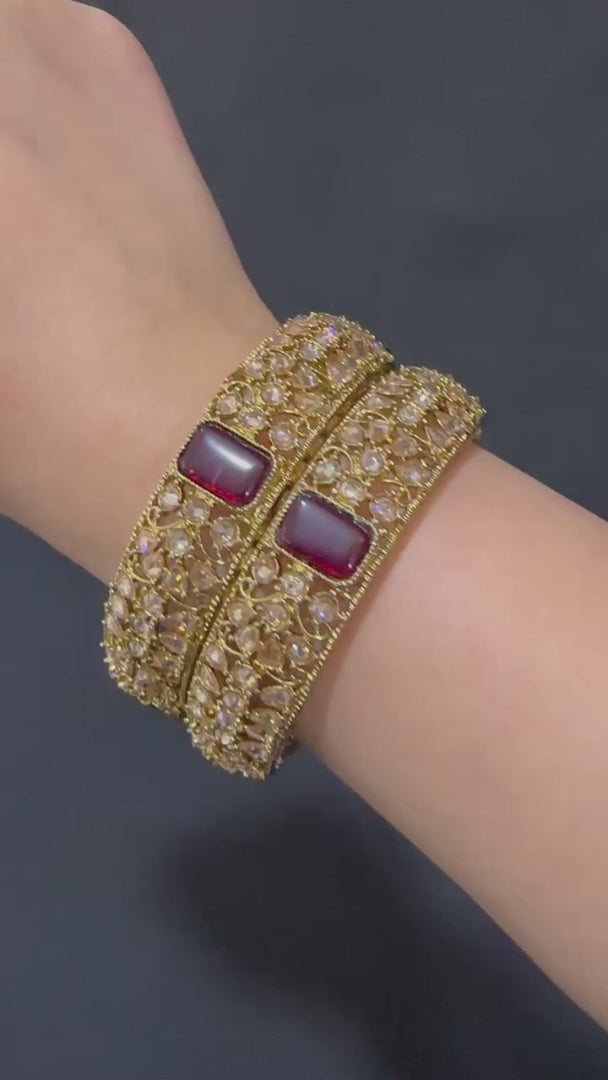 Gold pair of Karas with maroon stone from Lylahs Jewellery - Close Up Video